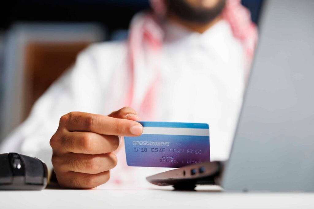 Corporate & Personal Bank Account Opening in UAE 1 arab businessman shops with credit card 2 1