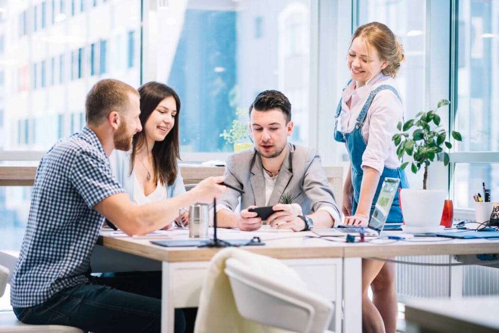 Document Clearing services 3 colleagues browsing smartphone discussion 1