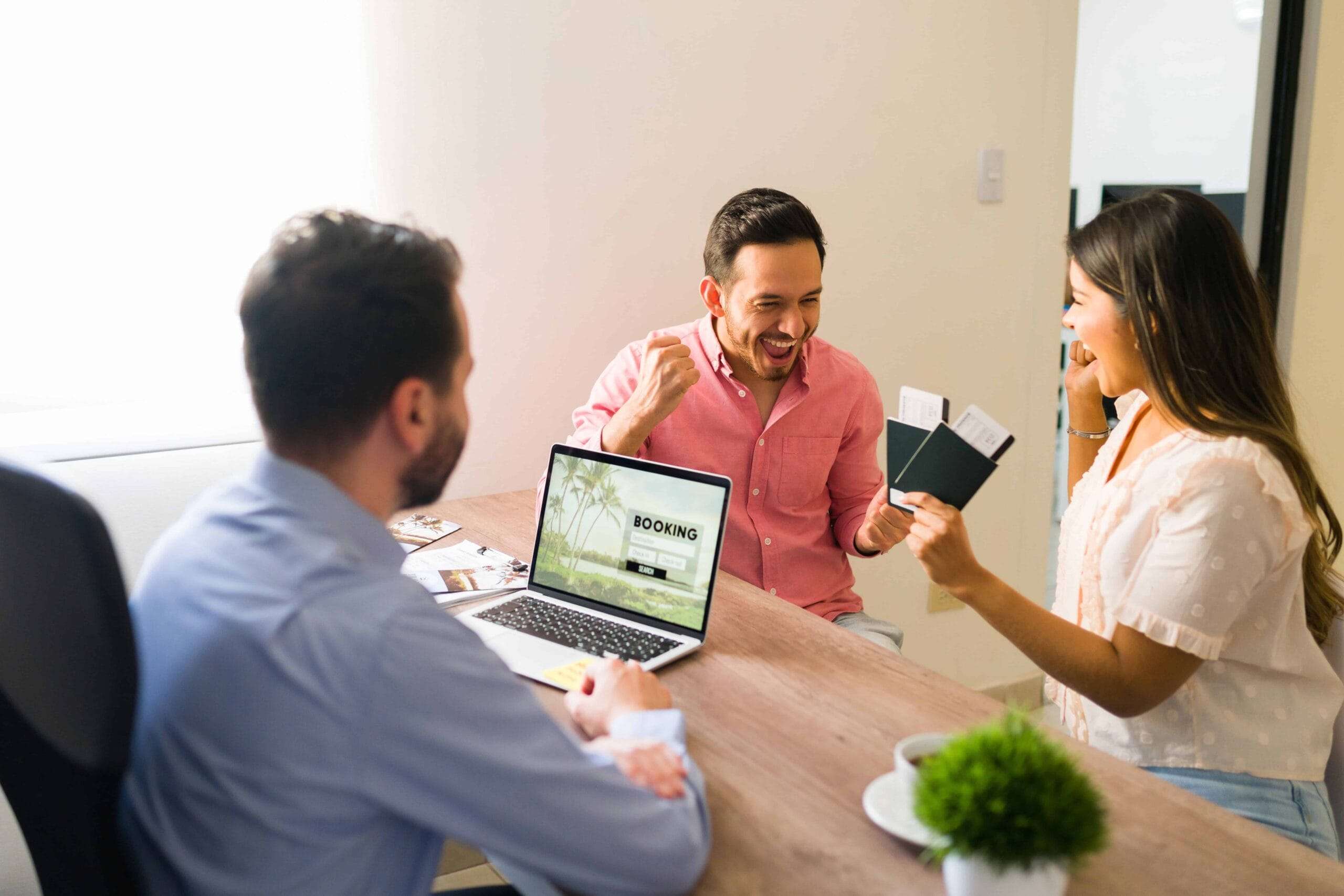 UAE Visa Services 6 i can t believe we are going vacations excited young couple celebrating shouting with happiness after receiving their passports plane tickets travel agency 1 scaled