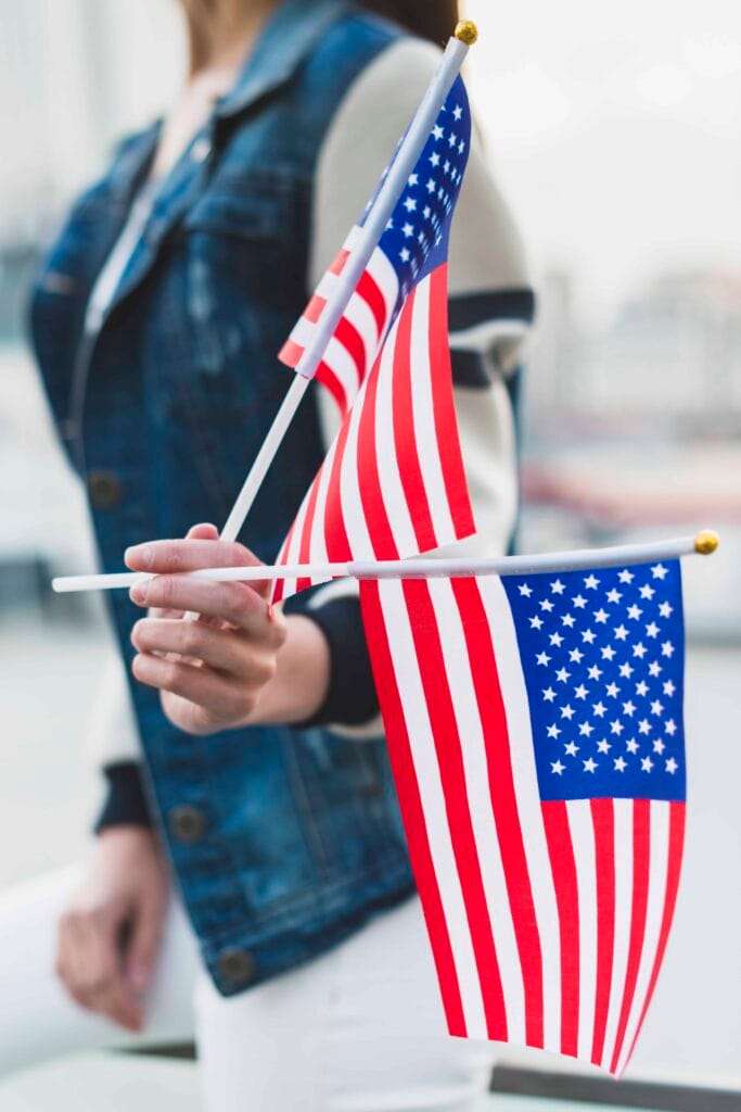 woman holding american flags independence day 2