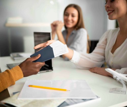 close-up-woman-taking-travel-tickets (1)