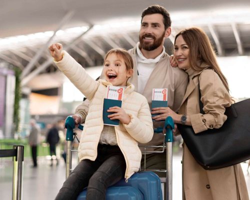 medium-shot-happy-family-airport (1)