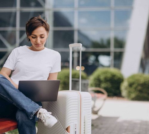 woman-travelling-working-computer-airport (1)